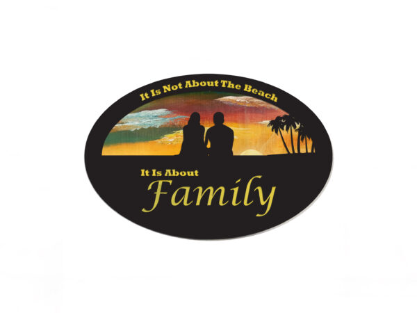 Oval-shaped sign with hand-painted sunset background and silhouette of a couple and a beach scene. Cutout text says "it is not about the beach, it is about family."