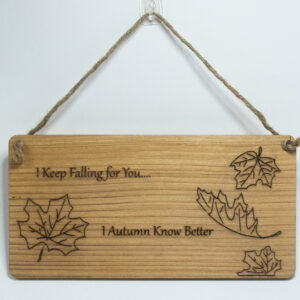 Laser engraved wood sign, featuring a falling leaves and the text "I keep falling for you... I autumn know better"