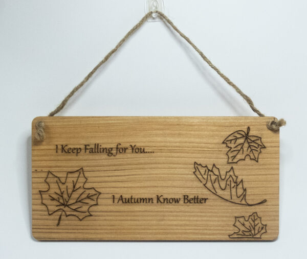 Laser engraved wood sign, featuring a falling leaves and the text "I keep falling for you... I autumn know better"