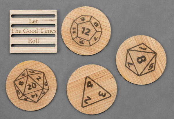 4 laser engraved wood coasters laid out with the stand. Each coaster features a different gaming die, and the stand says "Let the good times roll."