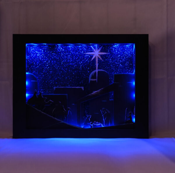 Beautiful 3d lightbox featuring a simple nativity scene illuminated with Blue light.