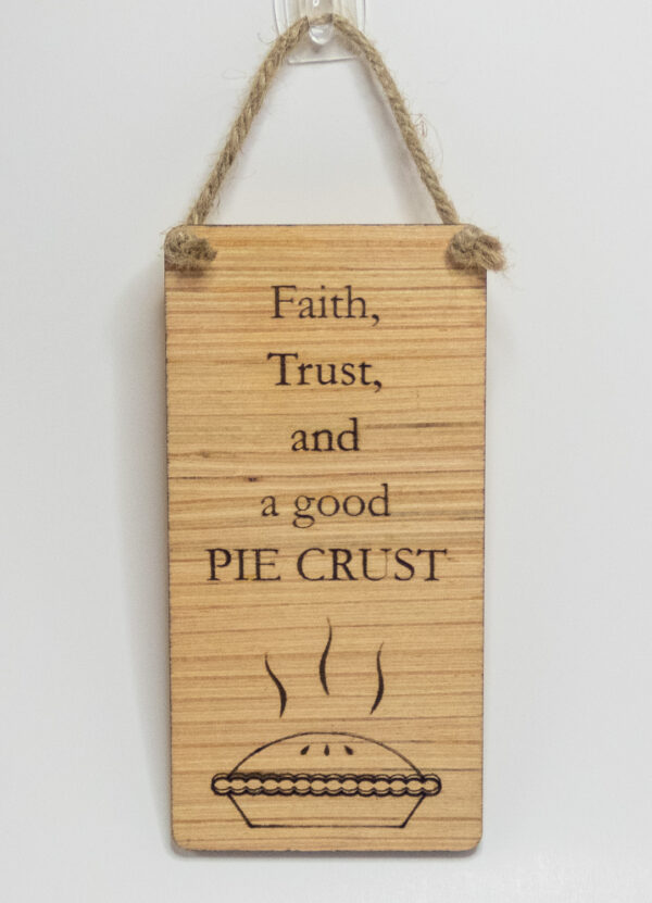 Laser engraved wood sign, featuring a pie and the text "Faith, Trust, and a good PIE CRUST"