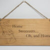 Laser engraved wood sign, featuring a chocolate bar and the text "Home Sweeeeeets... Oh, and home."