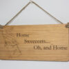 Laser engraved wood sign, featuring a chocolate bar and the text "Home Sweeeeeets... Oh, and home."