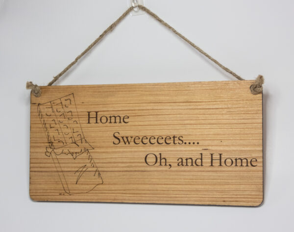 Laser engraved wood sign, featuring a chocolate bar and the text "Home Sweeeeeets... Oh, and home."